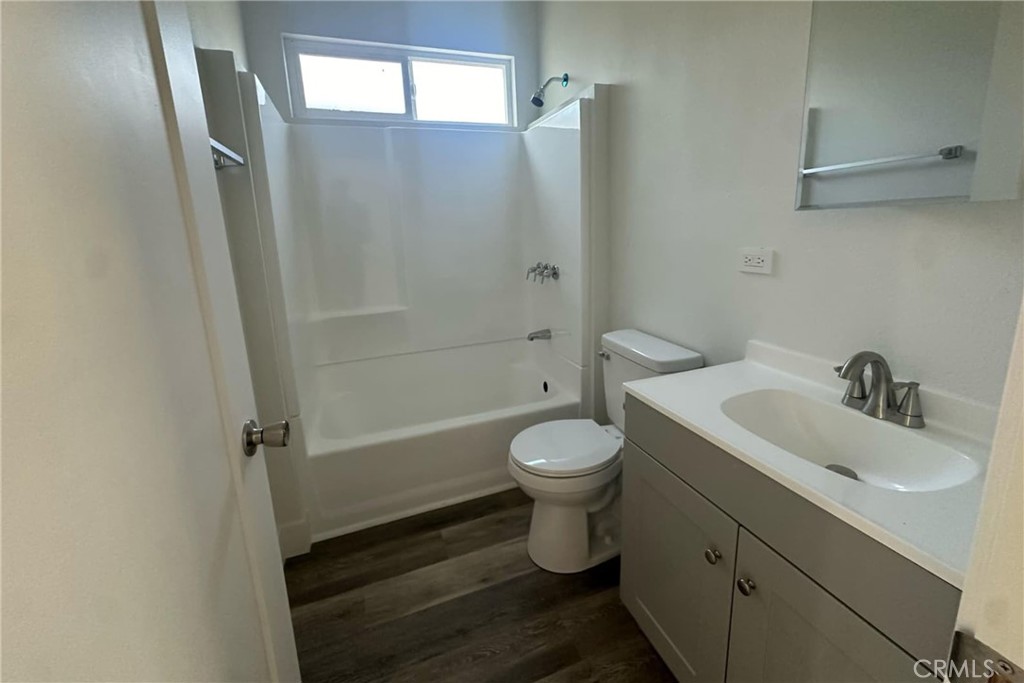 22113 Grand Terrace Road, Unit 16 Grand Terrace, CA 92313 - Photo 10 of 15 a bathroom with a sink toilet and shower
