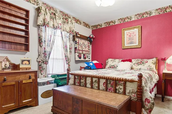 a front view of a house with swimming pool and porch with furniture