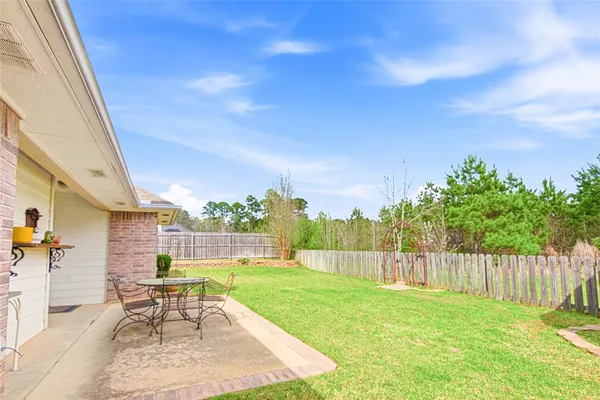 a garden with trees in front of it