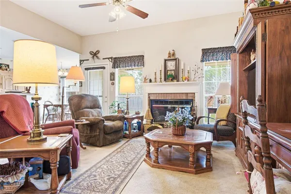 a kitchen with stainless steel appliances granite countertop a sink a stove a refrigerator and cabinets