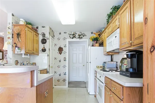 a kitchen with stainless steel appliances granite countertop a sink and cabinets