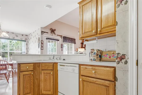 a kitchen with stainless steel appliances granite countertop a sink and cabinets