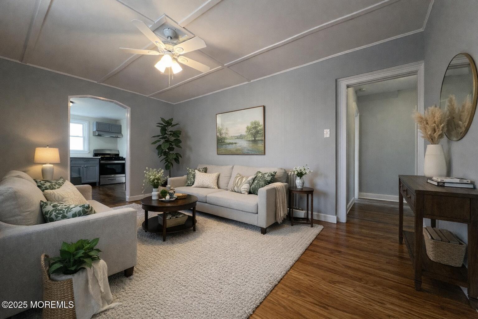 23 Rector Place, Unit B Red Bank, NJ 07701 - Photo 3 of 9 a living room with furniture and a chandelier
