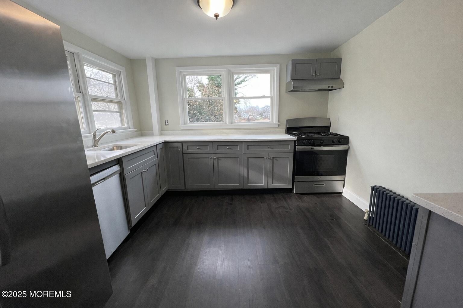 23 Rector Place, Unit B Red Bank, NJ 07701 - Photo 3 of 9 a kitchen with sink and stove