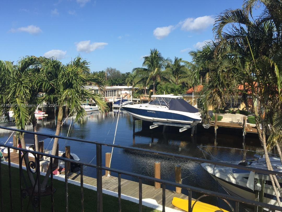 301 East McNab Road, Unit 205 Pompano Beach, FL 33060 - Photo 18 of 22 a view of a patio with swimming pool table and chairs
