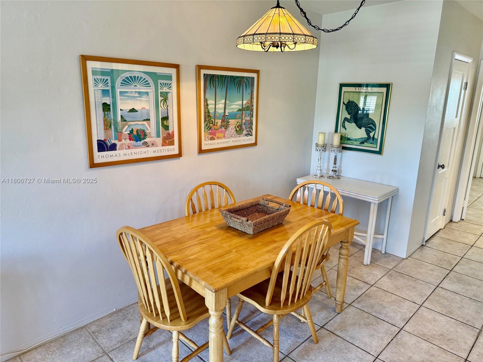 301 East McNab Road, Unit 205 Pompano Beach, FL 33060 - Photo 6 of 22 a view of a dining room with furniture