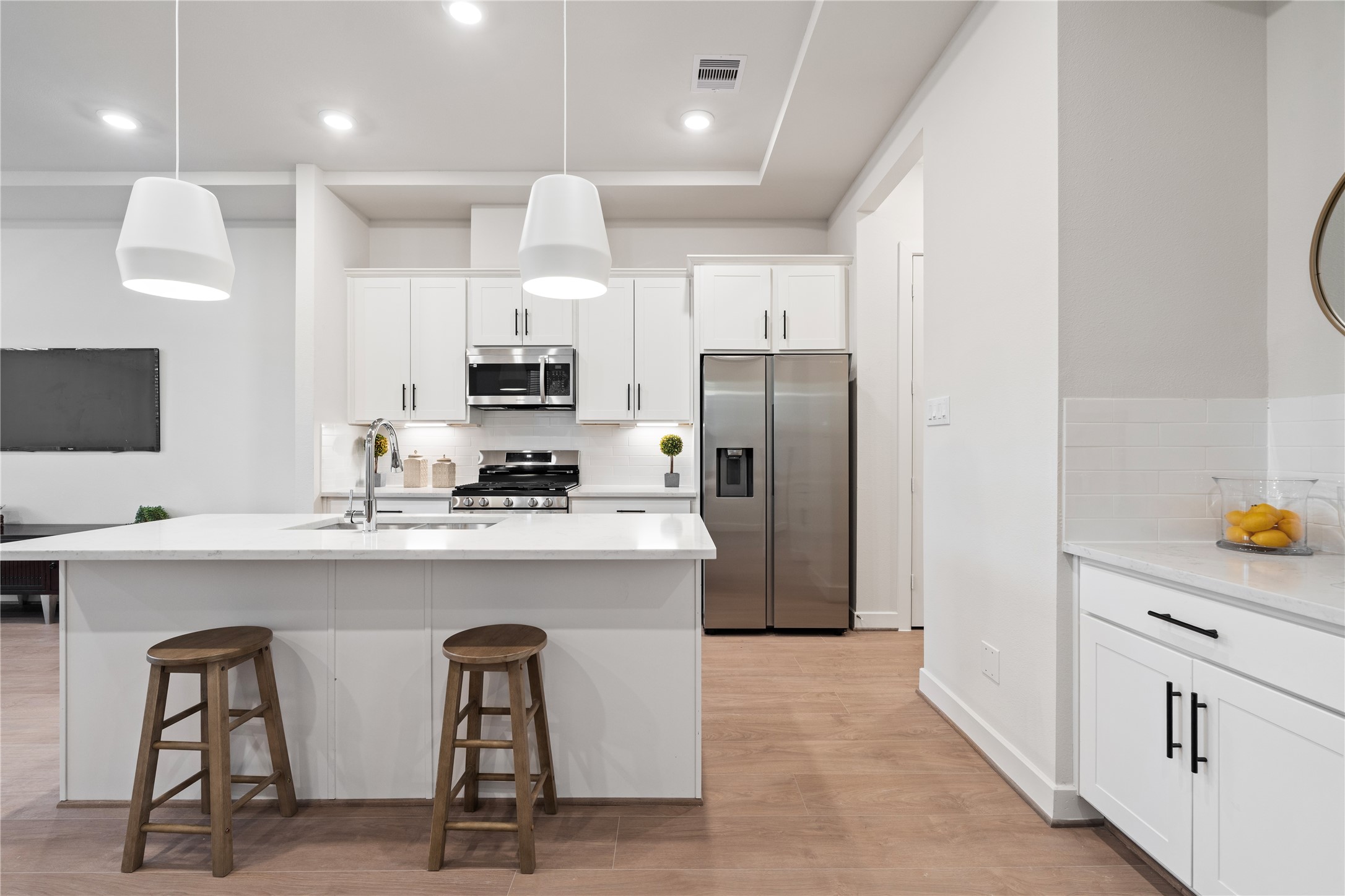 6445 Rena Street Houston, TX 77092 - Photo 16 of 33 Neutral finishes and Swiss engineered hardwood create a warm, modern foundation.