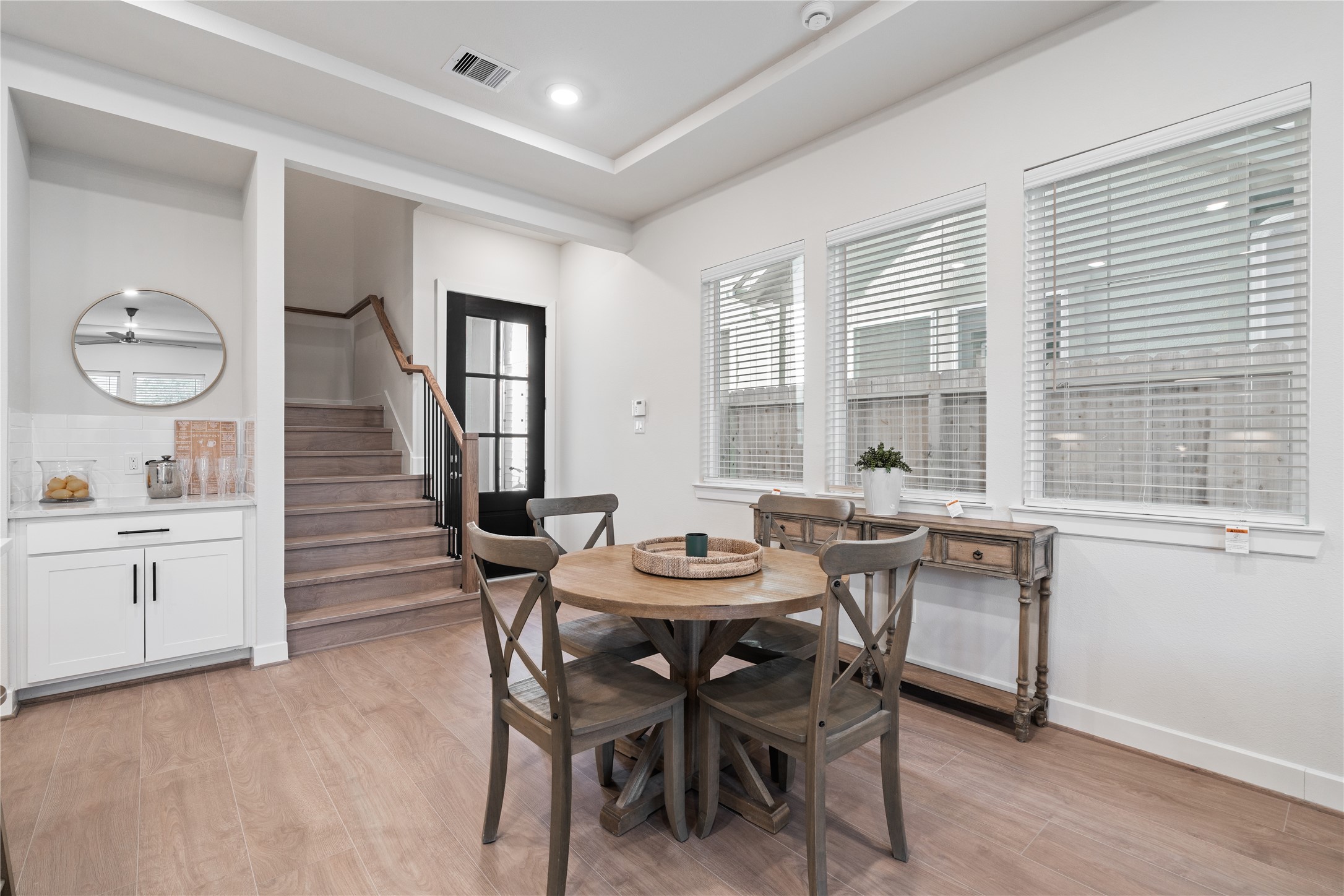 6445 Rena Street Houston, TX 77092 - Photo 19 of 33 Defined dining area positioned between the living and kitchen, with a built in dry bar that adds practical storage and counter space.