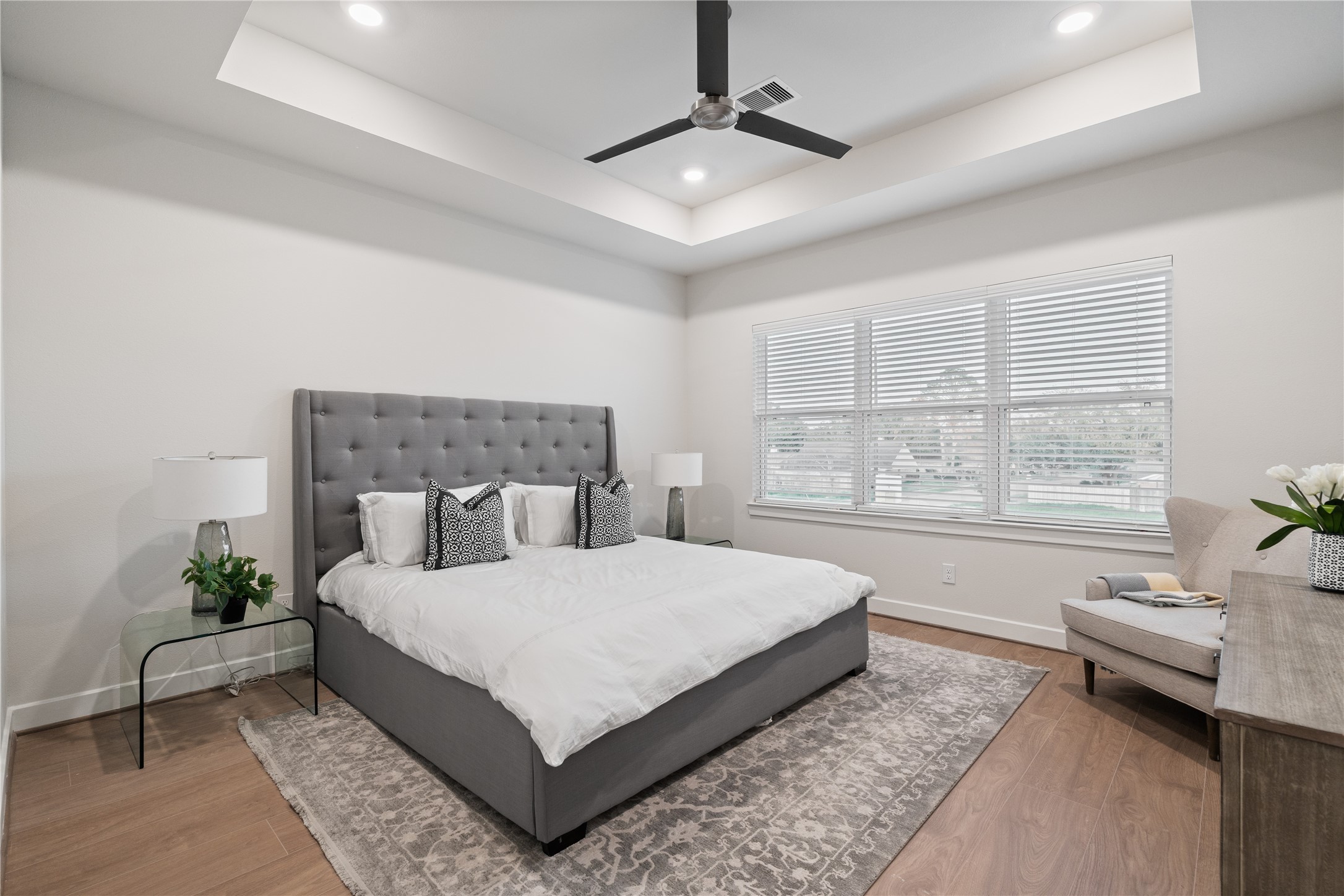 6445 Rena Street Houston, TX 77092 - Photo 20 of 33 Spacious primary suite with tray ceiling detail that adds subtle architectural dimension.