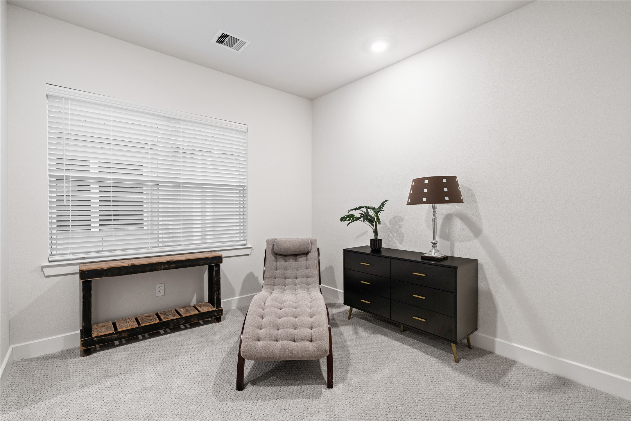 6445 Rena Street Houston, TX 77092 - Photo 29 of 33 Secondary bedroom with soft carpet and natural light, sized comfortably for everyday use.
