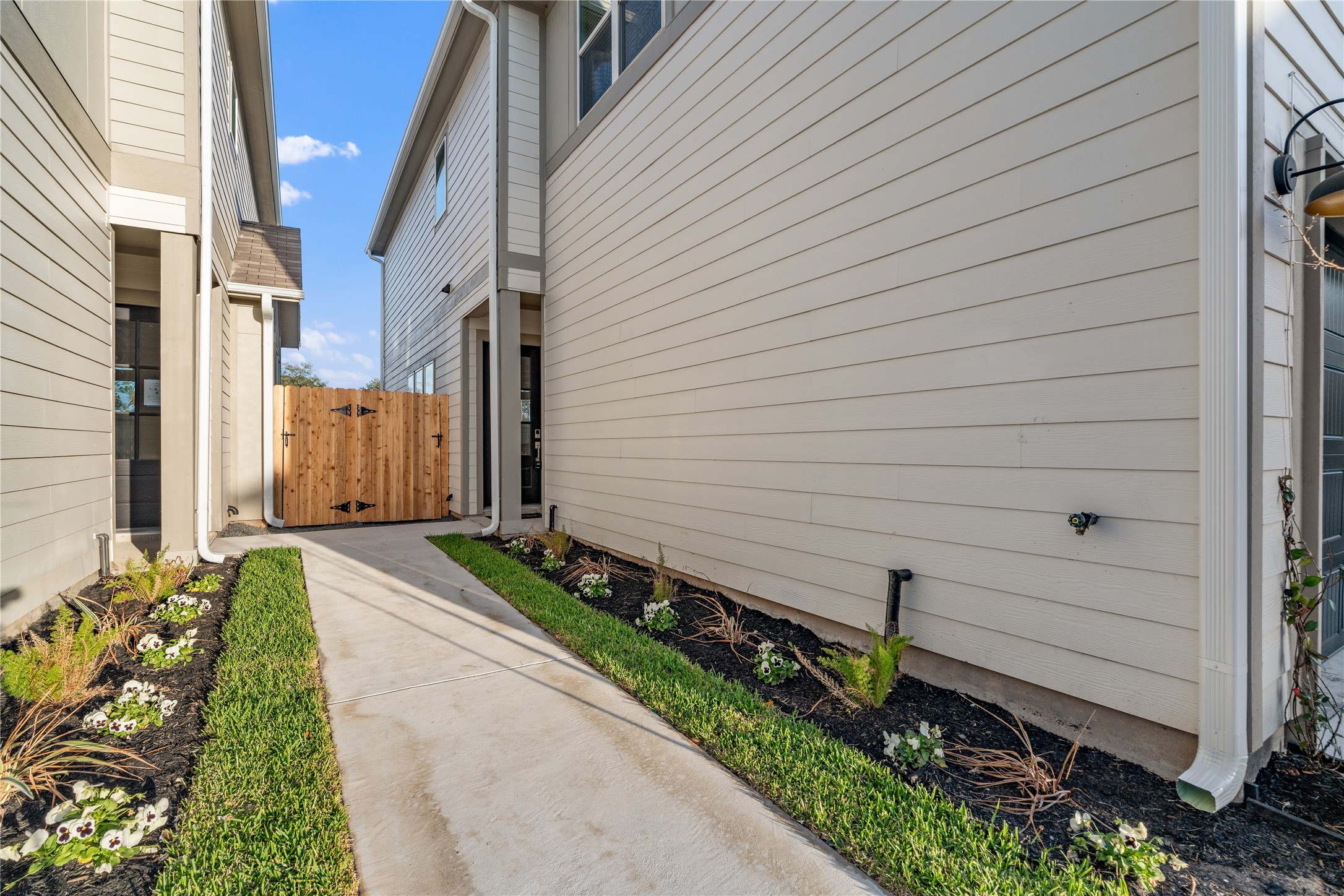6445 Rena Street Houston, TX 77092 - Photo 3 of 33 A landscaped walkway adds separation from the drive and creates a more private approach to the front door.