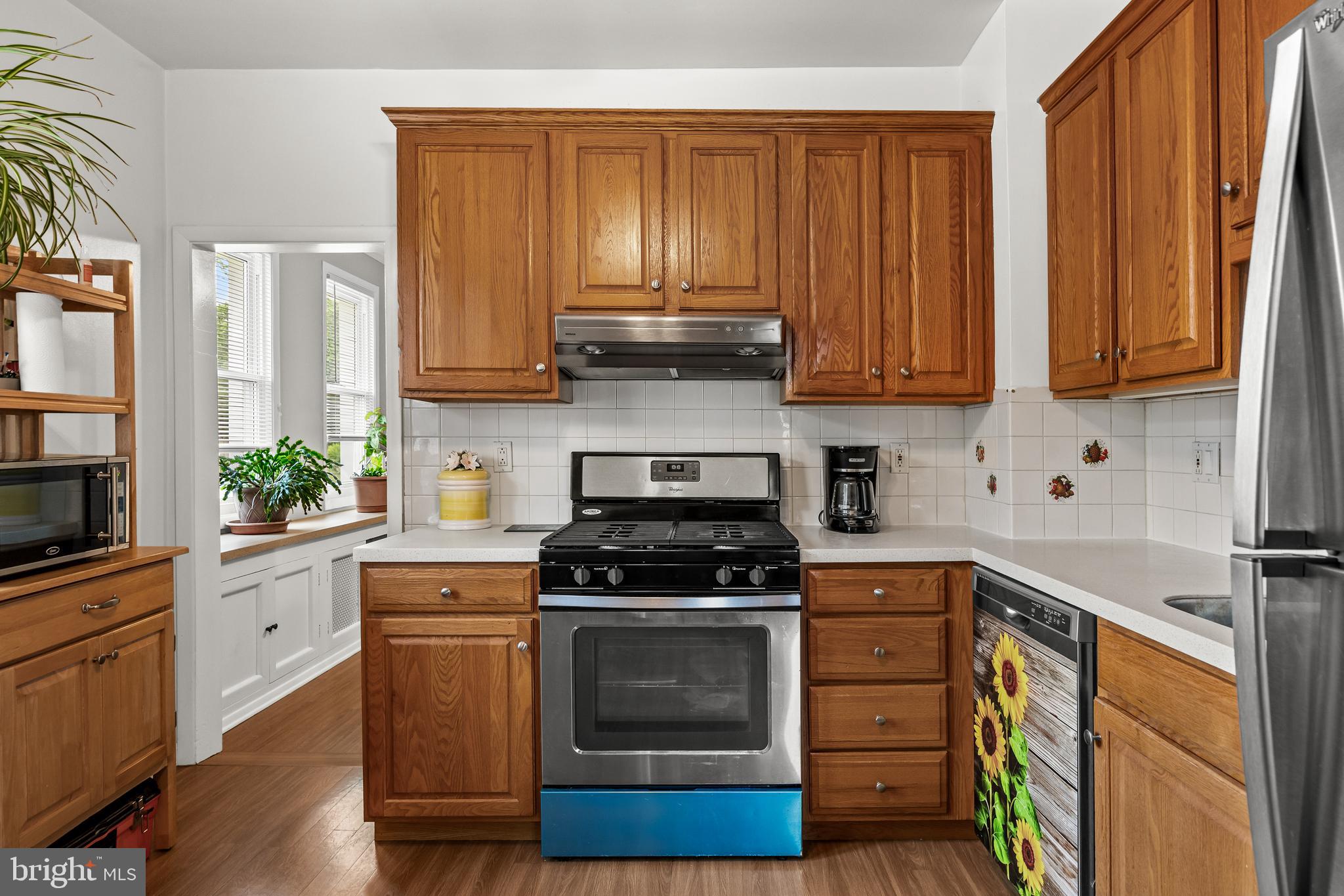 304 South Forklanding Road Maple Shade, NJ 08052 - Photo 11 of 29 a kitchen with granite countertop wood cabinets and stainless steel appliances