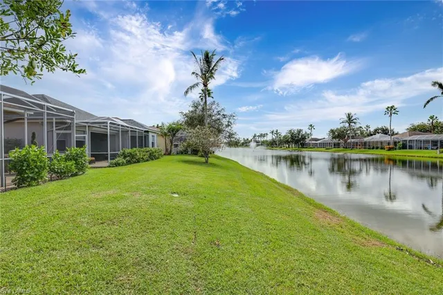 a view of a lake with a house in the background