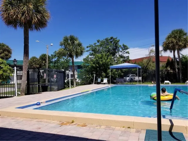 a view of outdoor space with seating space and swimming pool