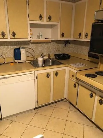 a view of a kitchen with appliances