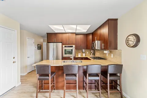 a living room with furniture fireplace and a window
