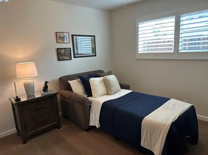 a white toilet sitting next to a bathroom sink