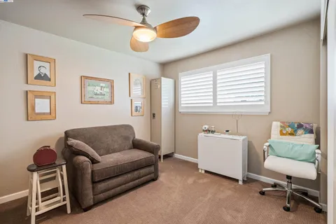 a bathroom with a sink vanity and mirror