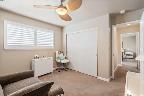 a bedroom with bed and a chandelier