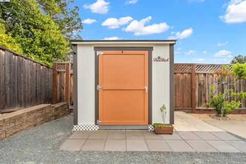 an aerial view of a house with a swimming pool