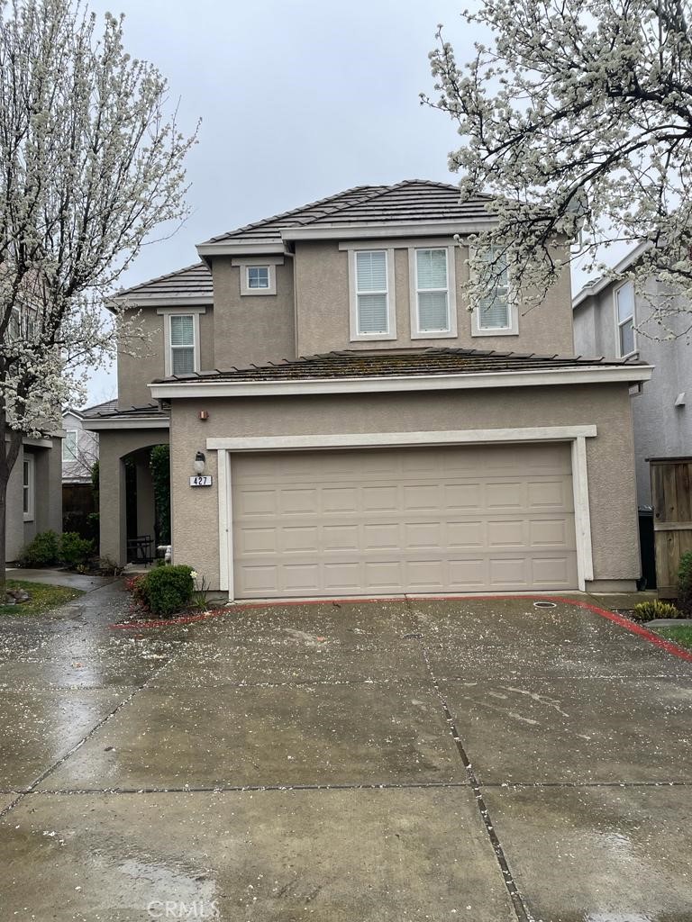 a front view of a house with yard