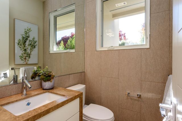 a utility room with sink dryer and washer