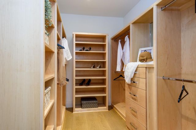a bedroom with a bed lamp and window