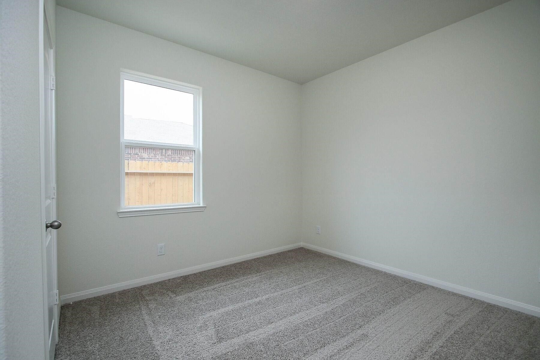 22422 Kennons Way Hockley, TX 77447 - Photo 10 of 11 an empty room with a window