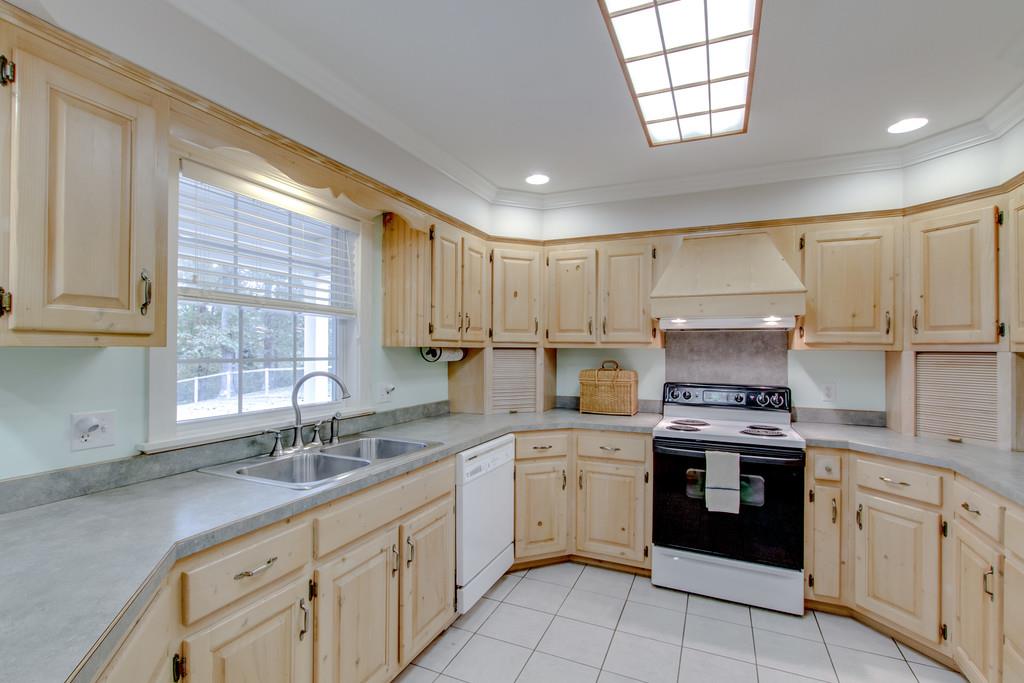 1727 Walden Ridge Road Manchester, TN 37355 - Photo 11 of 29 a kitchen that has a sink a stove and cabinets