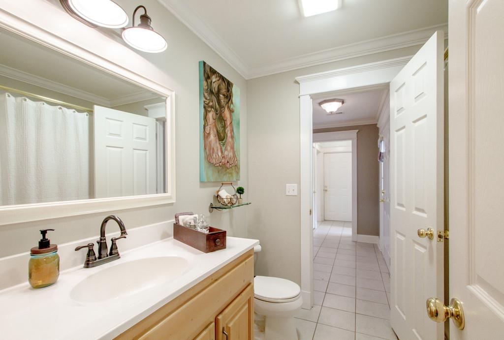 1727 Walden Ridge Road Manchester, TN 37355 - Photo 14 of 29 a bathroom with a sink a toilet and a large mirror