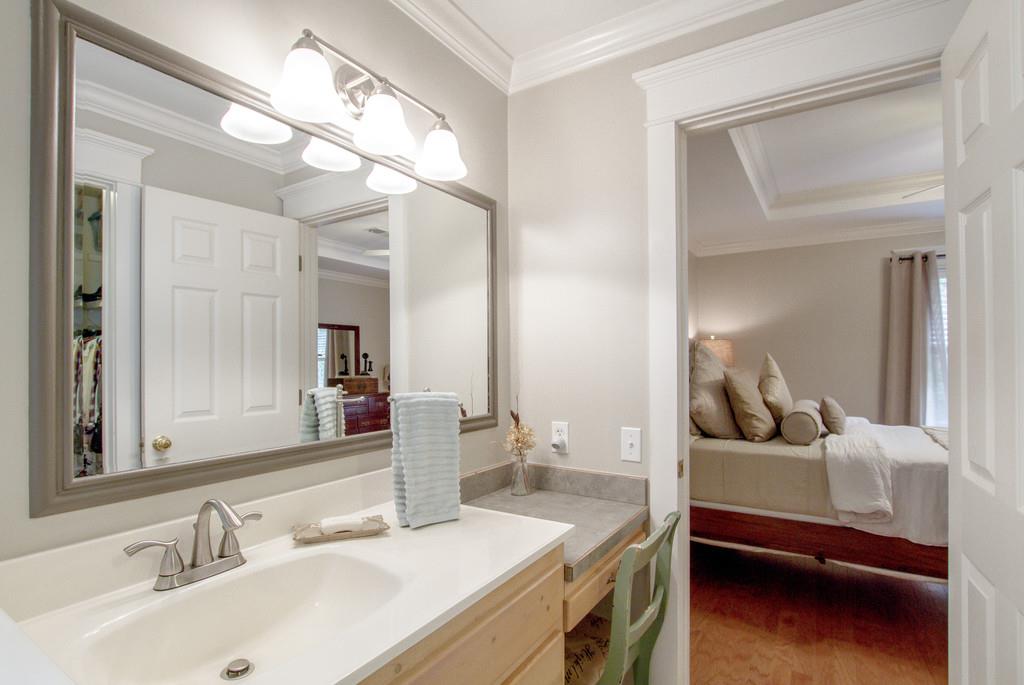 1727 Walden Ridge Road Manchester, TN 37355 - Photo 22 of 29 a en suite bathroom with a sink and a mirror
