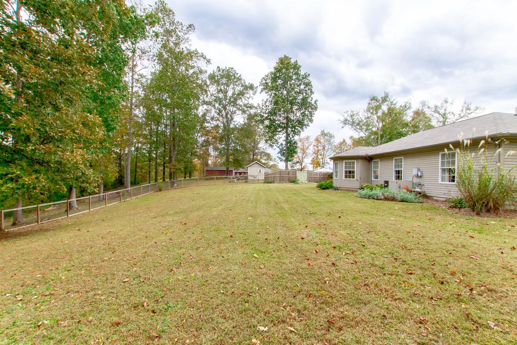1727 Walden Ridge Road Manchester, TN 37355 - Photo 26 of 29 a yellow house with trees in front of it
