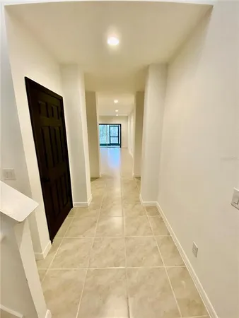 a view of hallway with a mirror