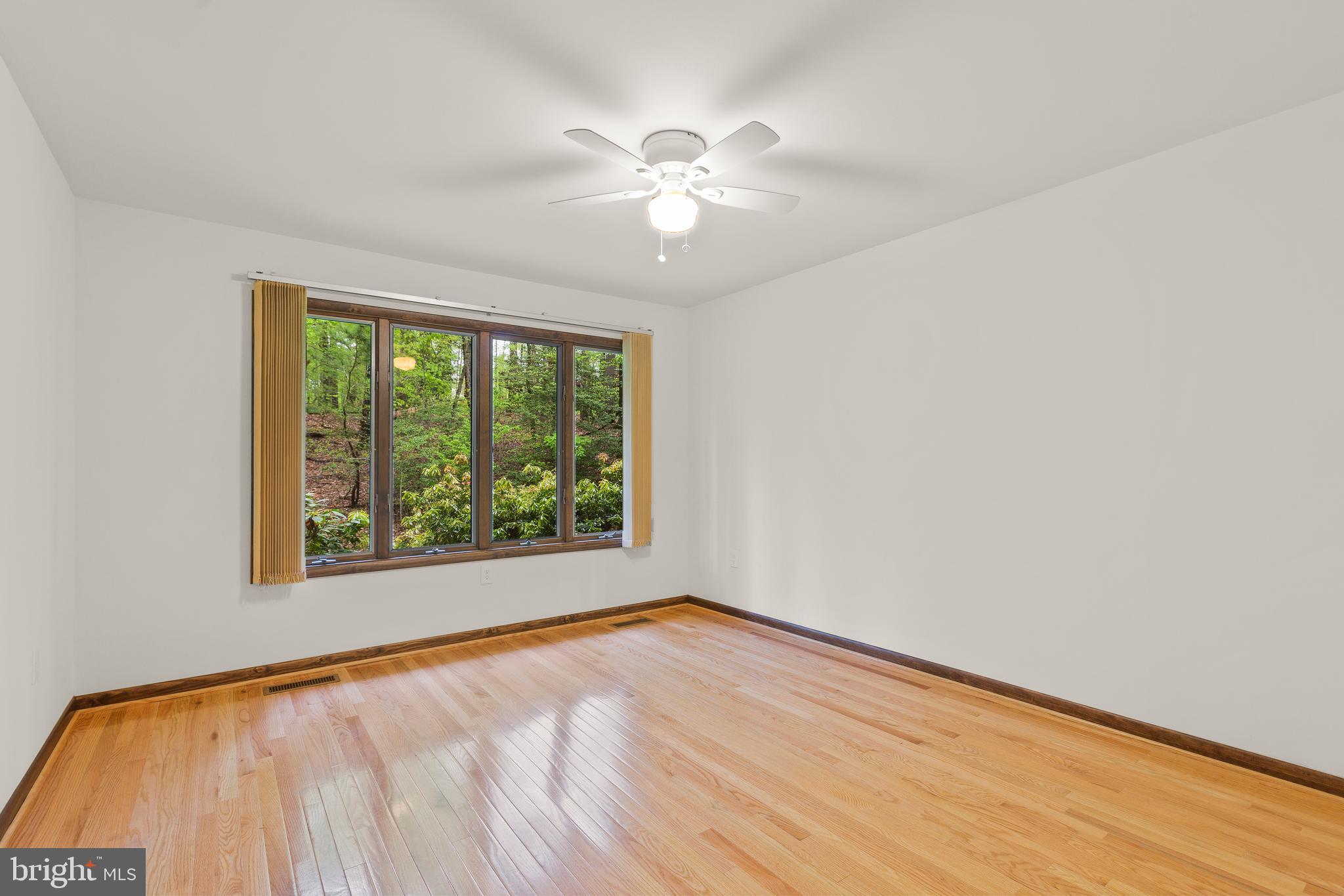 3200 Hickory Ridge Road Dunkirk, MD 20754 - Photo 23 of 44 a view of an empty room with wooden floor and a window