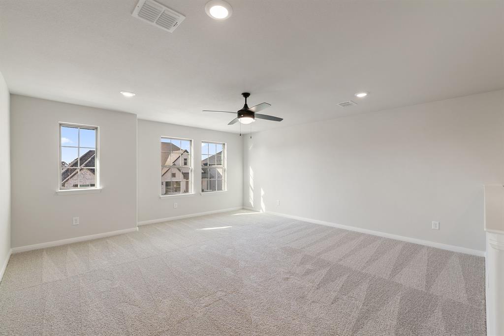1847 Cole Road Van Alstyne, TX 75495 - Photo 12 of 26 an empty room with windows and fan