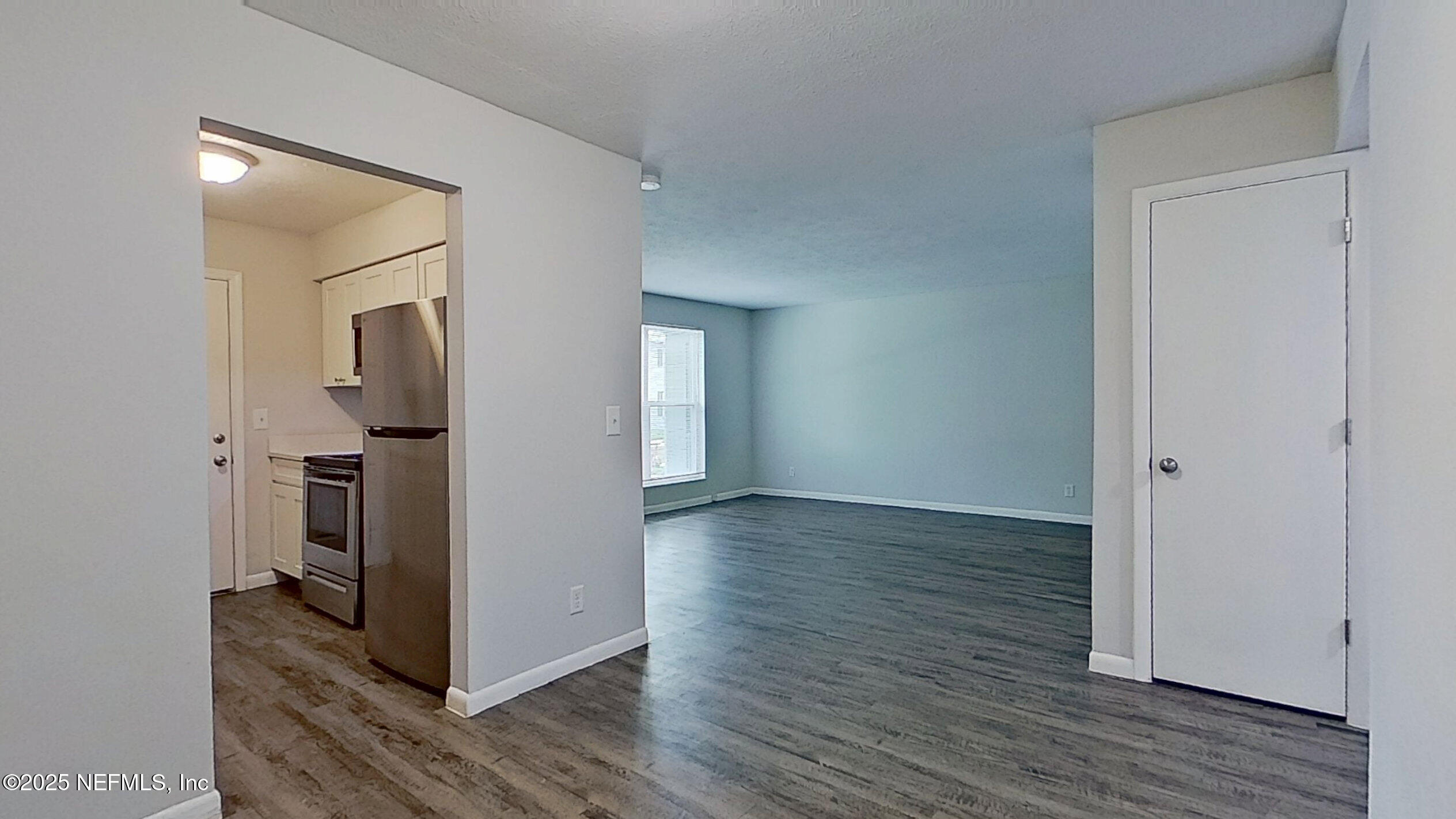 2216 Spring Park Road, Unit 8 Jacksonville, FL 32207 - Photo 13 of 32 a view of a hallway with wooden floor and a bathroom