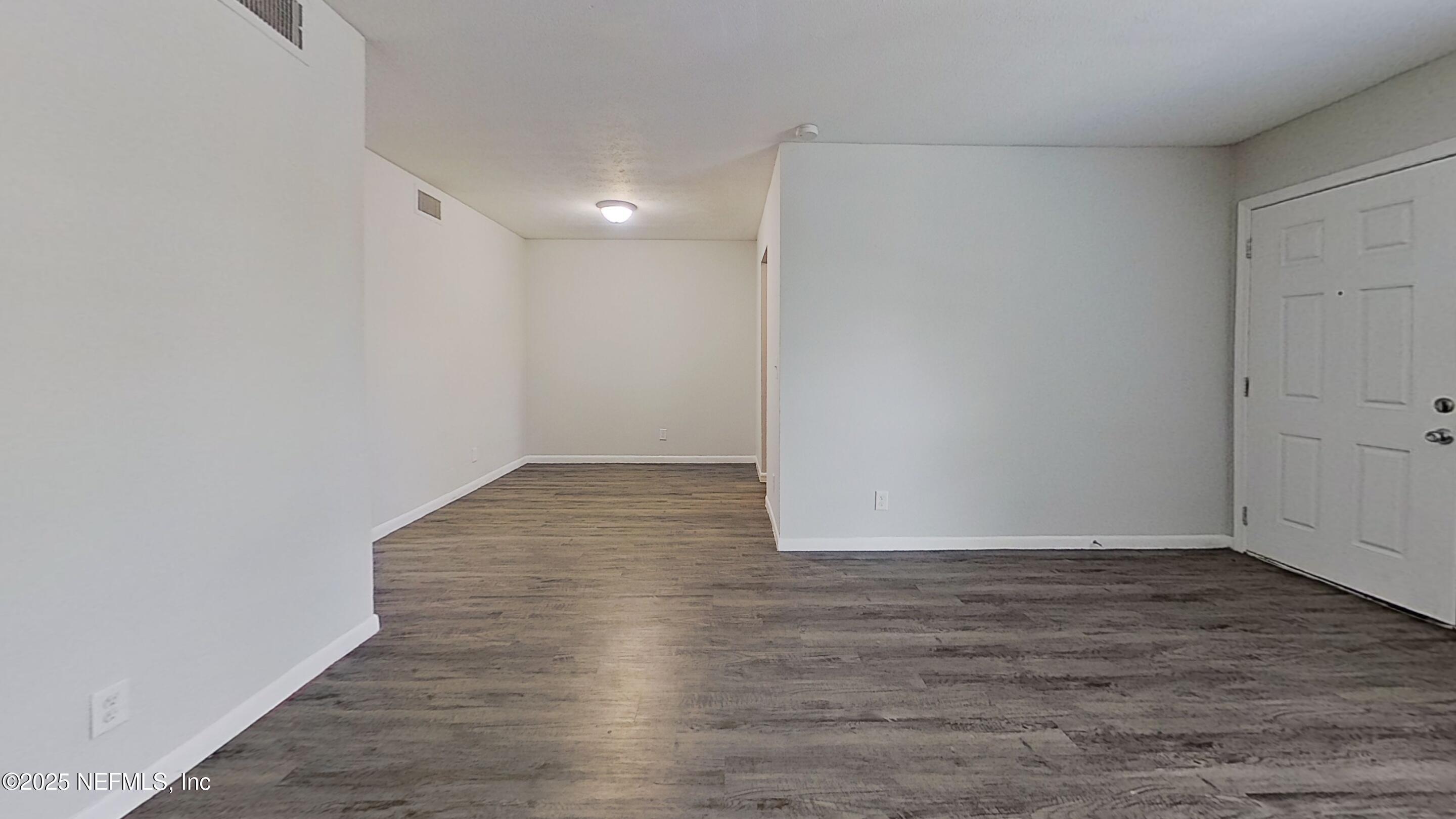 2216 Spring Park Road, Unit 8 Jacksonville, FL 32207 - Photo 15 of 32 a view of an empty room with wooden floor