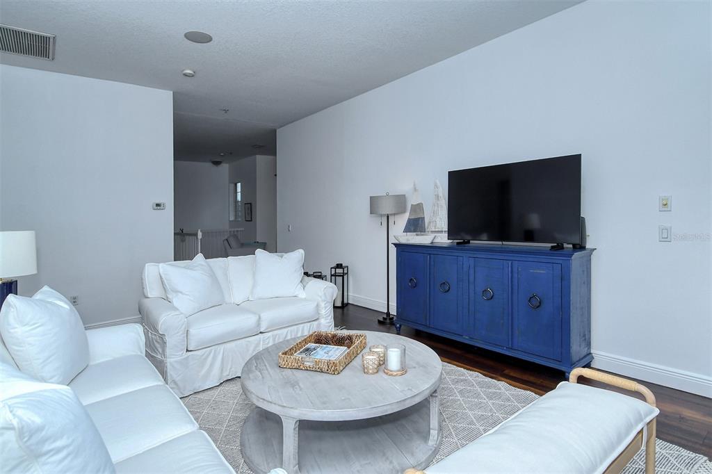 8363 Miramar Way, Unit 203 Lakewood Ranch, FL 34202 - Photo 11 of 73 a living room with furniture and a flat screen tv