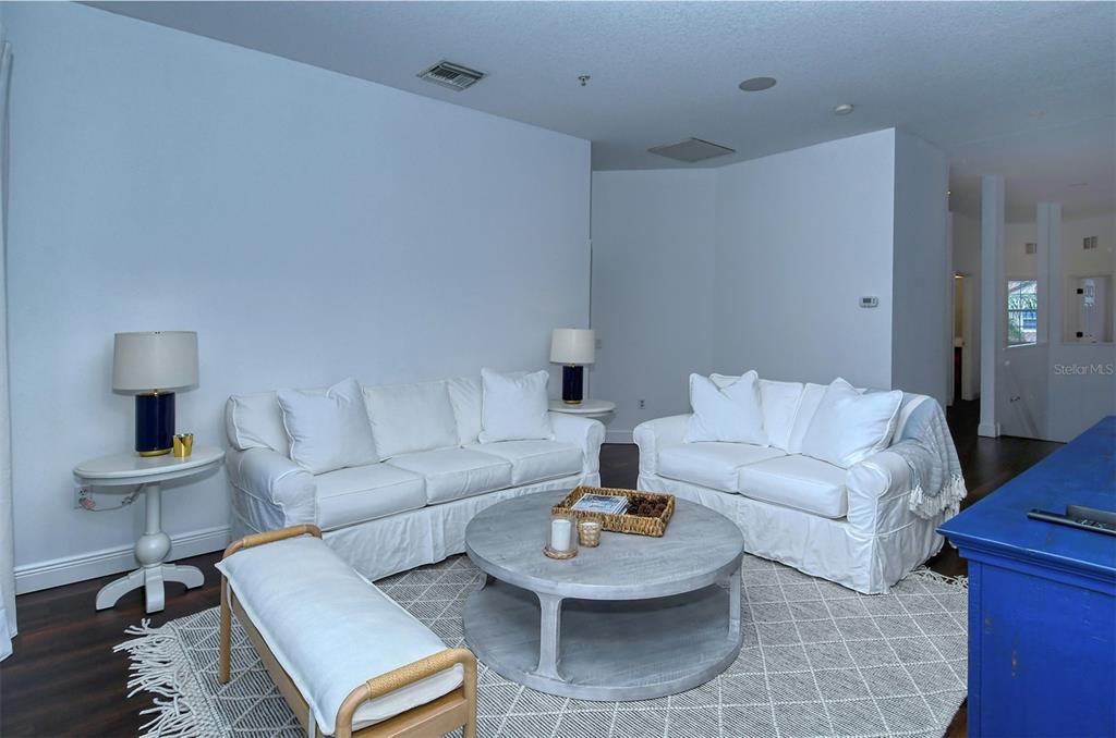 8363 Miramar Way, Unit 203 Lakewood Ranch, FL 34202 - Photo 12 of 73 a living room with furniture and a table