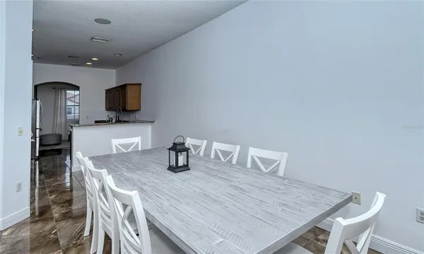 a kitchen with granite countertop a sink stove and cabinets