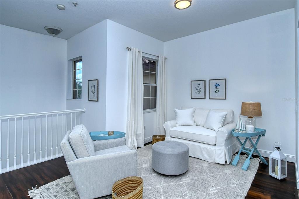 8363 Miramar Way, Unit 203 Lakewood Ranch, FL 34202 - Photo 22 of 73 a living room with furniture and a lamp