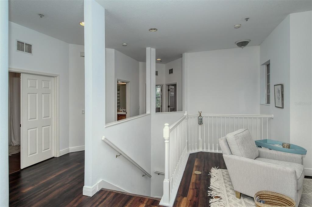 8363 Miramar Way, Unit 203 Lakewood Ranch, FL 34202 - Photo 25 of 73 a living room with furniture and wooden floor
