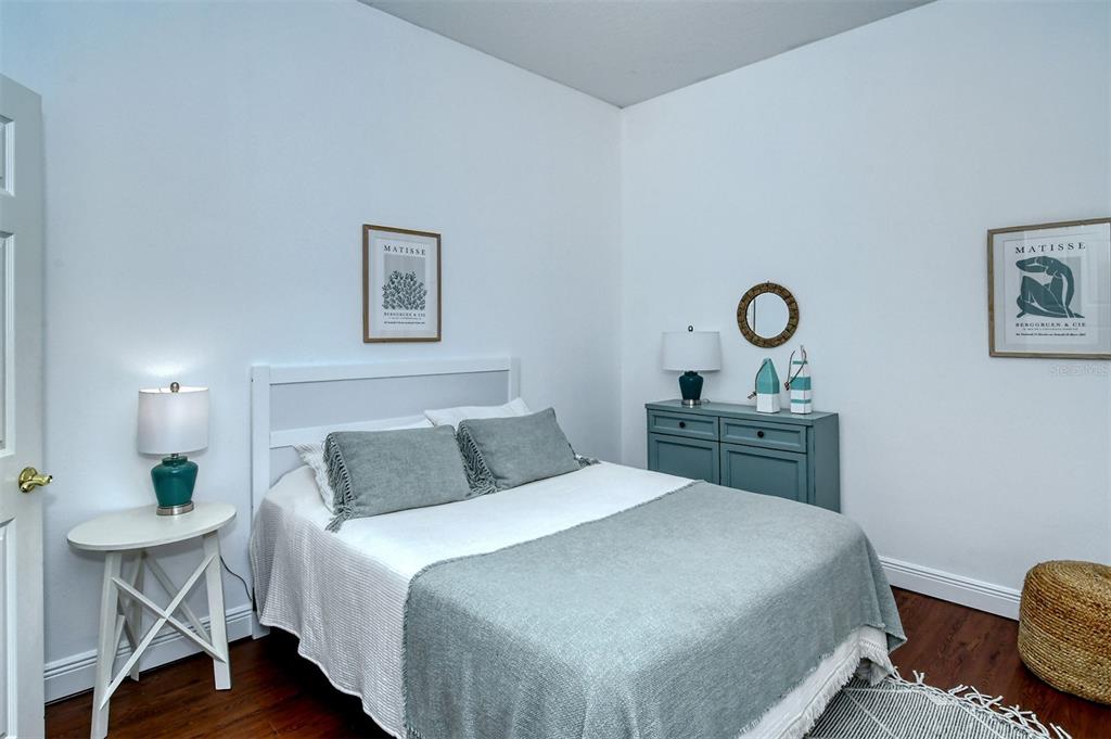 8363 Miramar Way, Unit 203 Lakewood Ranch, FL 34202 - Photo 27 of 73 a bedroom with a bed and a table in it