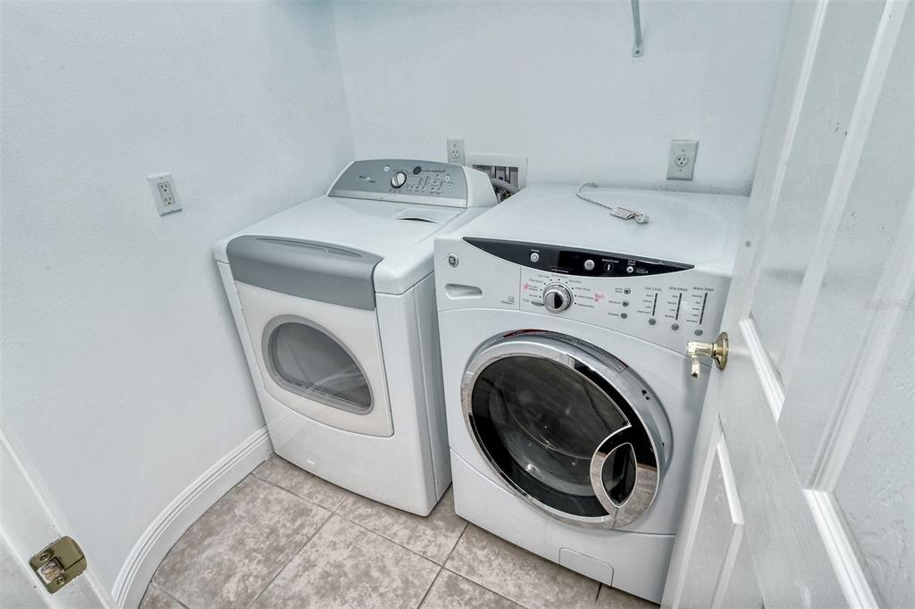 8363 Miramar Way, Unit 203 Lakewood Ranch, FL 34202 - Photo 30 of 73 a utility room with dryer and washer
