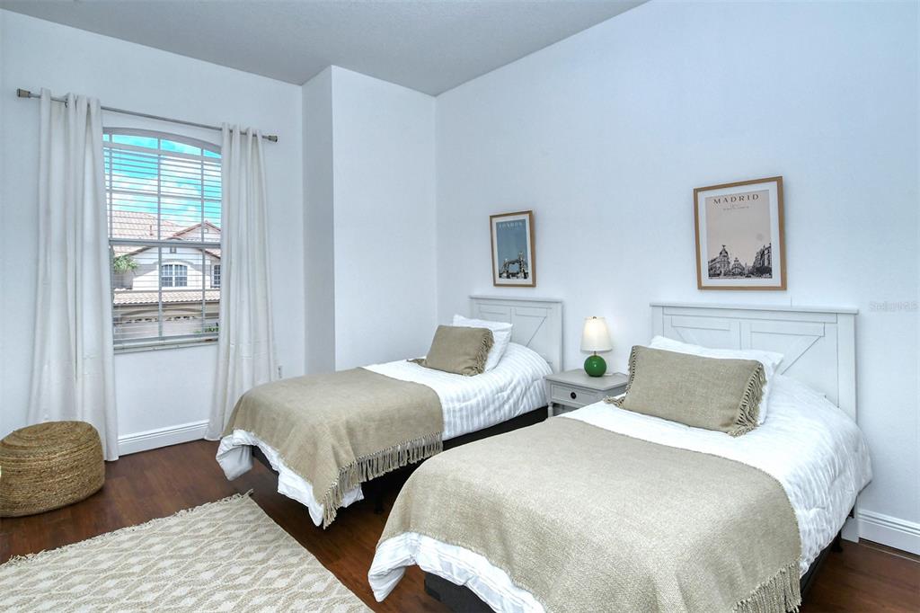 8363 Miramar Way, Unit 203 Lakewood Ranch, FL 34202 - Photo 31 of 73 a bedroom with two beds and a window