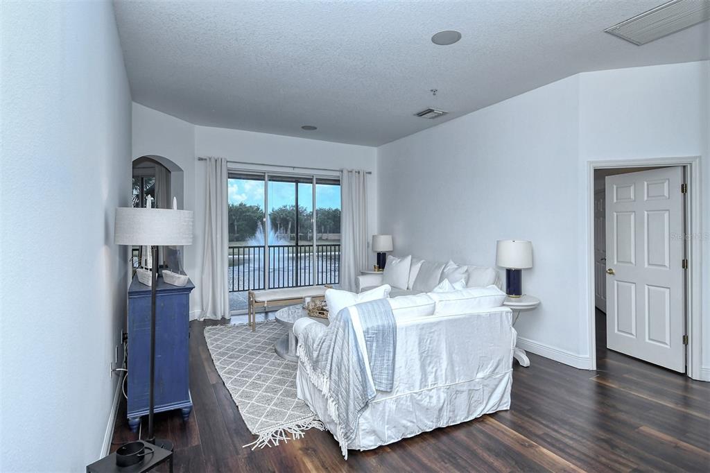 8363 Miramar Way, Unit 203 Lakewood Ranch, FL 34202 - Photo 4 of 73 a living room with furniture and a large window