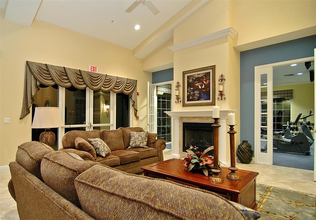 8363 Miramar Way, Unit 203 Lakewood Ranch, FL 34202 - Photo 50 of 73 a living room with furniture and a fireplace