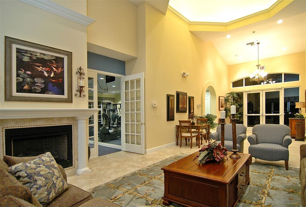 8363 Miramar Way, Unit 203 Lakewood Ranch, FL 34202 - Photo 51 of 73 a living room with furniture large window and potted plants
