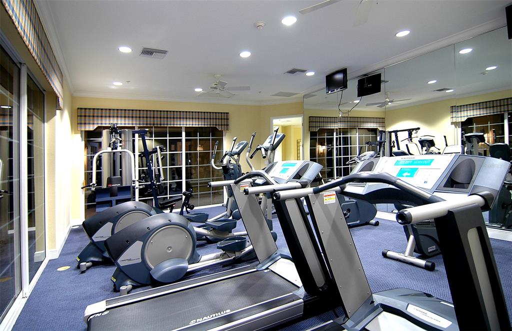 8363 Miramar Way, Unit 203 Lakewood Ranch, FL 34202 - Photo 55 of 73 a room with gym equipment and a large window