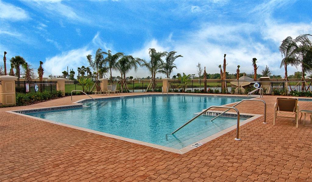 8363 Miramar Way, Unit 203 Lakewood Ranch, FL 34202 - Photo 58 of 73 a view of a swimming pool with outdoor seating and plants